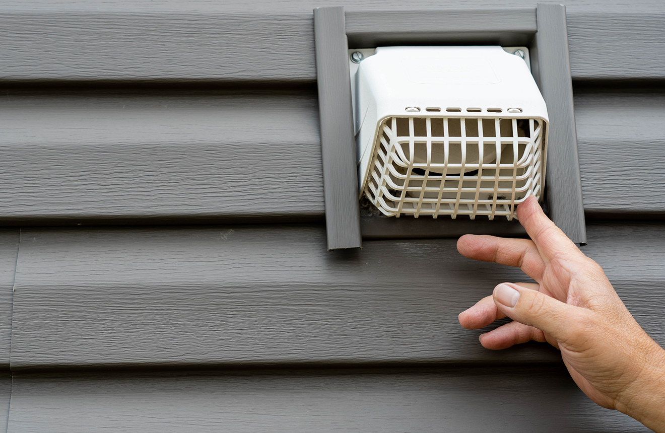 white-plastic-dryer-vent-on-the-exterior-of-a-home dryer vent cover to prevent mice from entering your home